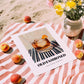 Old Fashioned – on Striped Tablecloth, American Cocktail Wall Art, unframed on coastal sand