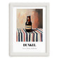 Dunkel – on Striped Tablecloth, German Beer Wall Decor, placed in minimal white frame