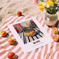 Maté – Uruguayan Street Café Scene, Uruguayan Beverage Poster, unframed on coastal sand