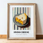 Swiss – on Striped Tablecloth, Cheese Wall Painting, in wooden frame leaning on the floor