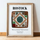 Rostock, Germany – Travel Poster, in wooden frame leaning on the floor