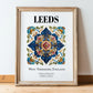 Leeds, England – Vintage Travel Poster, in wooden frame leaning on the floor
